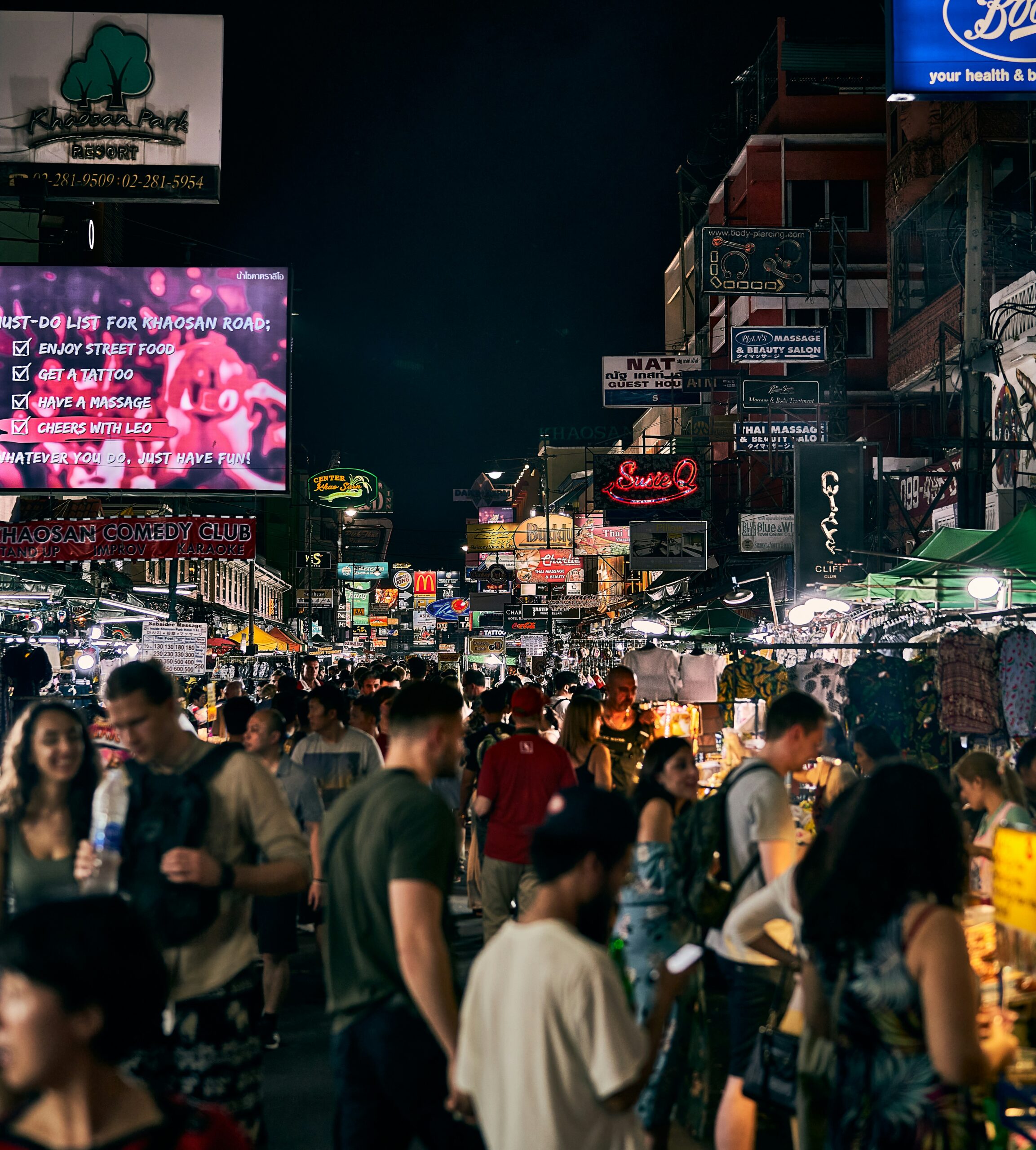 Neon signs and crowds on Khao San Road at night