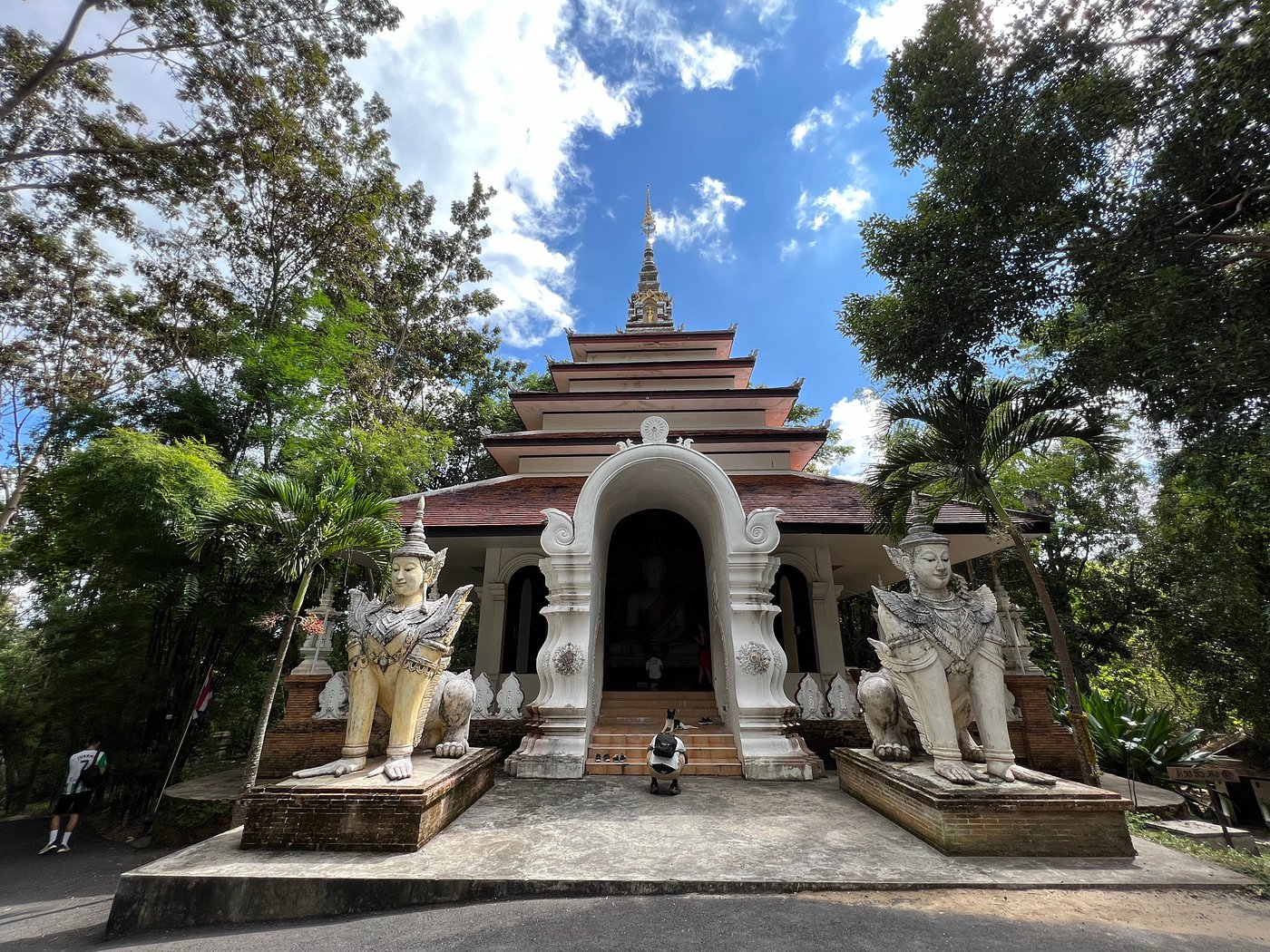 Moss-covered stone temple at Wat Pha Lat in the jungle